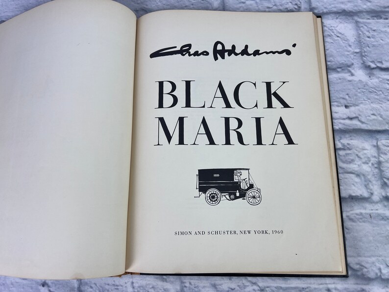 May include: A black and white image of a book titled "Black Maria" by Caro Addams. The book cover features a black and white illustration of a vintage delivery truck.
