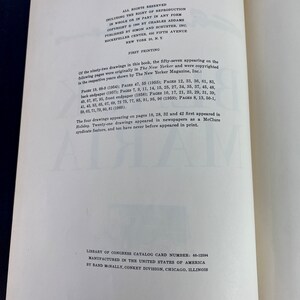 May include: A black and white book with the title "Drawings" by Charles Addams. The book includes a copyright notice and information about the first printing. The text states that the drawings in the book were originally published in The New Yorker magazine.