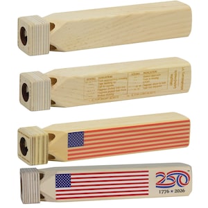 May include: Four wooden train whistles with a square mouthpiece and a long, cylindrical body. One whistle is plain, one features a printed train signal chart, one displays an American flag, and one shows an American flag with a 250 1776-2026 logo.