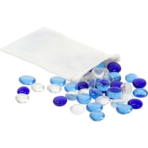 May include: A white fabric bag with a drawstring closure spilling out blue and clear glass pebbles.