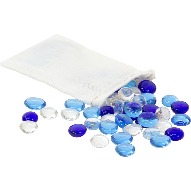 May include: A white fabric bag with a drawstring closure spilling out blue and clear glass pebbles.