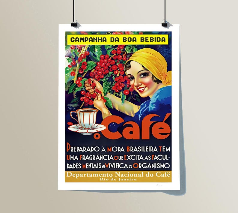 May include: Vintage coffee advertisement poster. It features a woman in a yellow headscarf holding coffee cherries. The word "cafe" is in large orange letters. Text at the bottom reads "Prepared in the Brazilian style".
