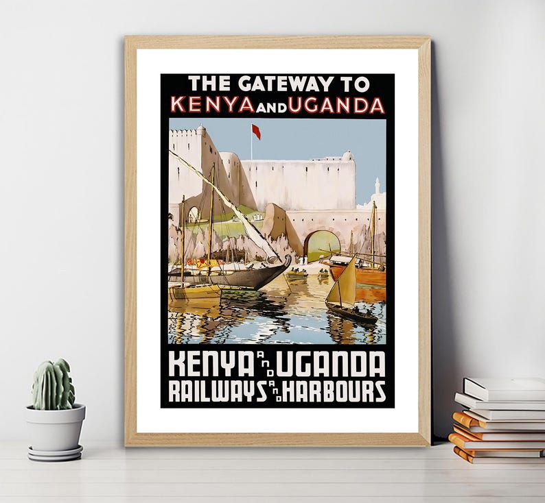 May include: Vintage travel poster advertising the Kenya and Uganda Railways and Harbours. The poster features a colorful illustration of a harbor scene with boats and a building in the background. The text "The Gateway to Kenya and Uganda" is at the top of the poster, and the text "Kenya and Uganda Railways and Harbours" is at the bottom.