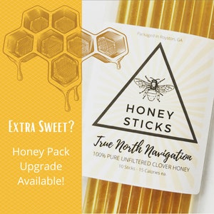 May include: A package of 10 honey sticks, labeled "True North Navigation 100% Pure Unfiltered Clover Honey". The package is white with a black triangle containing a bee and the words "Honey Sticks". The package is also labeled "Packaged in Royston, GA".