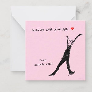 May include: A pink greeting card with a white envelope. The card features a black illustration of a figure skater and the text "Gliding into your DMs" with a red heart. The card also includes "xoxo Nathan Chen."