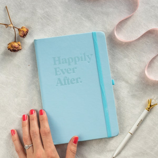 Happily Ever After Starts Here: Elegant A5 Notebook with Baby Blue Soft-Touch Cover. Get a head start on your wedding planning.