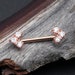 A Pair of Rose Gold Geometric Arrow Sparkles Nipple Barbell - Clear Gem 