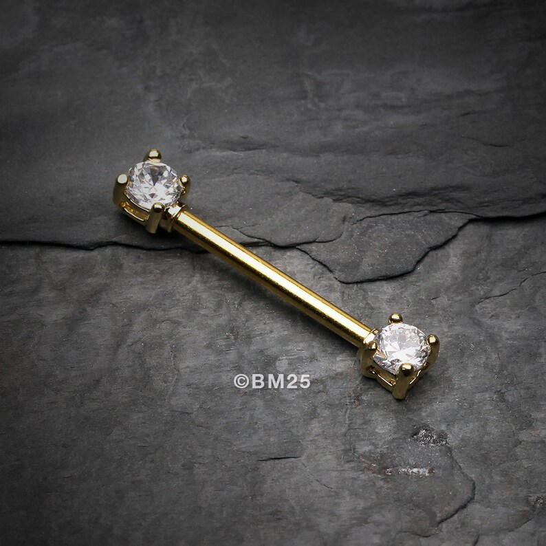 A Pair of Golden Double Prong Gem Nipple Barbell Ring Clear Gem