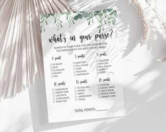 May include: A printable game card with a green floral border and the text "what's in your purse?"  Search in your purse for the items below. The person with the most points wins!"  The card lists items to find in a purse with points assigned to each item.  The items are categorized by points: 1 point, 3 points, 5 points, 10 points, 15 points, and 20 points.