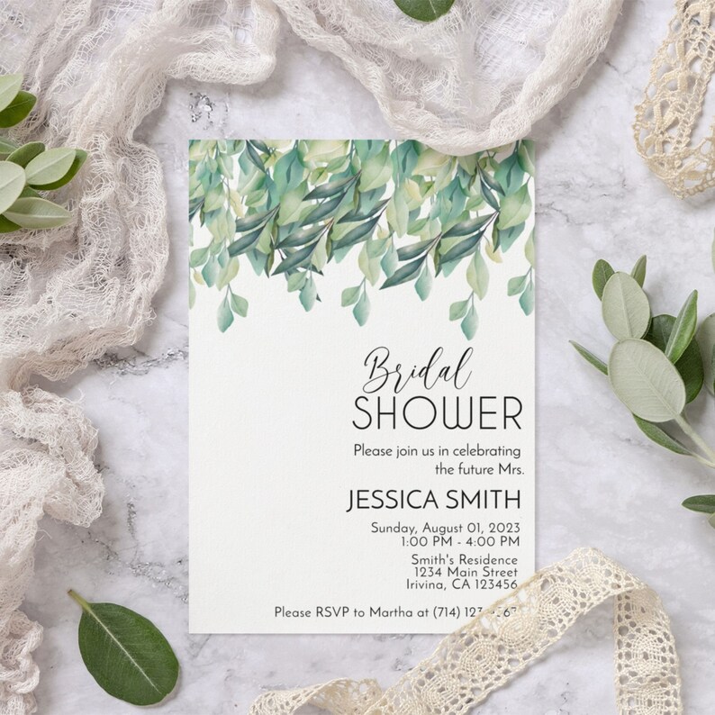 May include: A white bridal shower invitation with green watercolour leaves and the text "Bridal Shower", "Please join us in celebrating the future Mrs. Jessica Smith", "Sunday, August 01, 2023 1:00 PM - 4:00 PM", "Smith's Residence 1234 Main Street, Irivina, CA 123456", and "Please RSVP to Martha at (714) 127.67".
