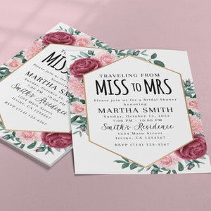 May include: A white bridal shower invitation with a gold hexagonal frame and floral accents. The text reads "Traveling from Miss to Mrs. Please join us for a bridal shower honoring Martha Smith. Sunday, October 12, 2023. 7:00 PM - 10:00 PM. Smith's Residence. 1234 Main Street. Irvine, CA 1234567. RSVP (714) 123-4567."