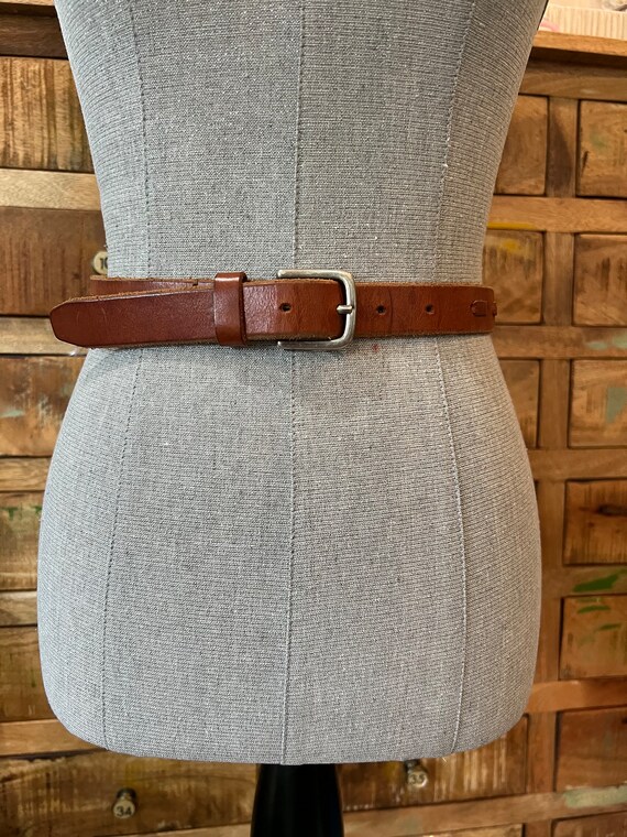 Cowboys brown leather skinny belt with woven detai