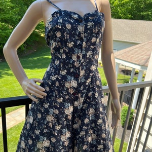 Bonnie Evans vintage 90s navy blue/floral romper crisscross back and button down front.