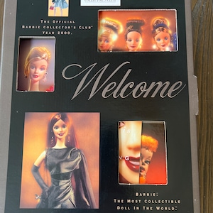 May include: A collector's edition Barbie box set. The box is black with silver text that reads "Welcome". The box features images of Barbie dolls and the text "The Official Barbie Collector's Club Year 2000". The box also reads "Barbie: The Most Collectible Doll in the World."