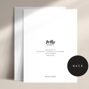 May include: A white greeting card with a matching envelope. The card features the text "By Allie Design Co." and other details. The back of the card is labeled "BACK" in a black circle. The inside of the card is blank.
