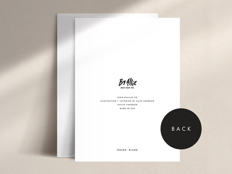 May include: A white greeting card with a matching envelope. The card features the text "By Allie Design Co." and other details. The back of the card is labeled "BACK" in a black circle. The inside of the card is blank.