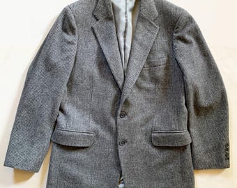 May include: A gray pinstripe blazer with a single button closure and two front pockets.