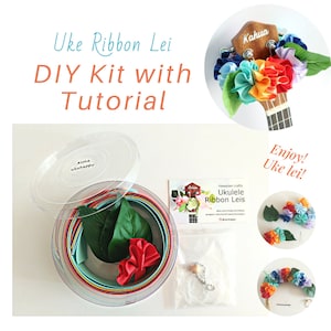 May include: A DIY kit for making ukulele ribbon leis. The kit includes colorful ribbon, a clear plastic container, and instructions. The image also shows examples of finished leis on a ukulele and as hair accessories.