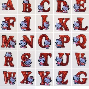 May include: A set of 26 iron-on patches featuring the letters of the alphabet. Each letter is decorated with a Hello Kitty character in a red and white dress. The patches are made of sequins and are perfect for adding a touch of whimsy to clothing, bags, or other accessories.