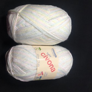 May include: Two skeins of white yarn with pink and yellow stripes. The label reads "baby civona 100% orlon 20 oz / 3 ply Leewards Crafts Bazaar"