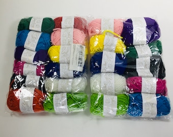 May include: A collection of 24 skeins of yarn in various colors, including red, orange, yellow, green, blue, purple, pink, and white. The yarn is arranged in two rows of 12 skeins each.