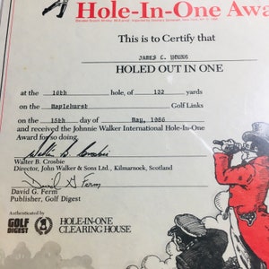 May include: A certificate of achievement for a hole-in-one at the Maplehurst Golf Links. The certificate is dated May 15, 1986 and is signed by Walter B. Crosbie, Director of John Walker & Sons Ltd. and David G. Ferm, Publisher of Golf Digest. The certificate is authenticated by the Hole-In-One Clearing House.