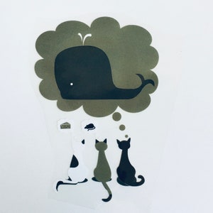 May include: A whimsical sticker design featuring three cats gazing up at a thought bubble with a whale. The whale is thinking of a cheese wedge and a mouse. The cats are in black, white, and olive green.