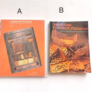 May include: Two books, one titled "A Typographic Workbook" with a close-up of letterpress printing blocks, and the other titled "Scroll Saw Fretwork Patterns" with a colorful image of intricate scroll saw patterns.