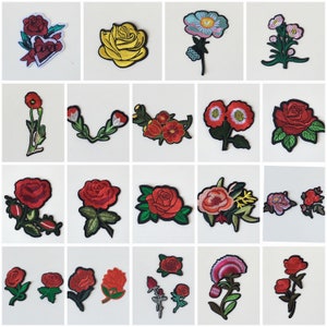 May include: Assortment of embroidered iron-on patches featuring various flower designs. The patches include red roses, yellow roses, pink flowers, and a red flower with the word "love" in a heart shape.