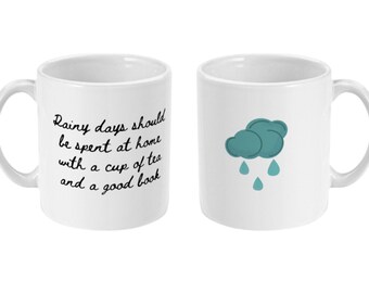 Rainy days should be spent at home with a cup of tea and a good book Quote Mug
