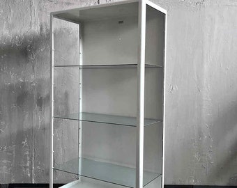 Vintage open white doctor's display case, doctor's shelf, apothecary cabinet from 1971