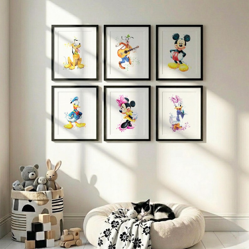 A grid arrangement of six colorful Mickey Mouse and friends posters framed on a white wall above a modern wooden nursery crib.