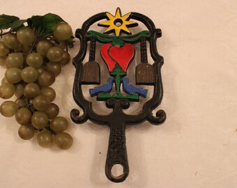 Vintage Wilton Cast Iron Black Cooling Trivet - Pennsylvania Dutch Design, Hand Painted Brooms, Hearts, Star, Blue birds