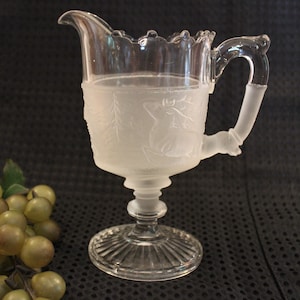 Circa 1880&#39;s Gillinder & Sons Pedestal Creamer with Frosted Panel - Pioneer Pattern, AKA Tippacanoe, Westward Ho with Deer, Bear, and Cabin