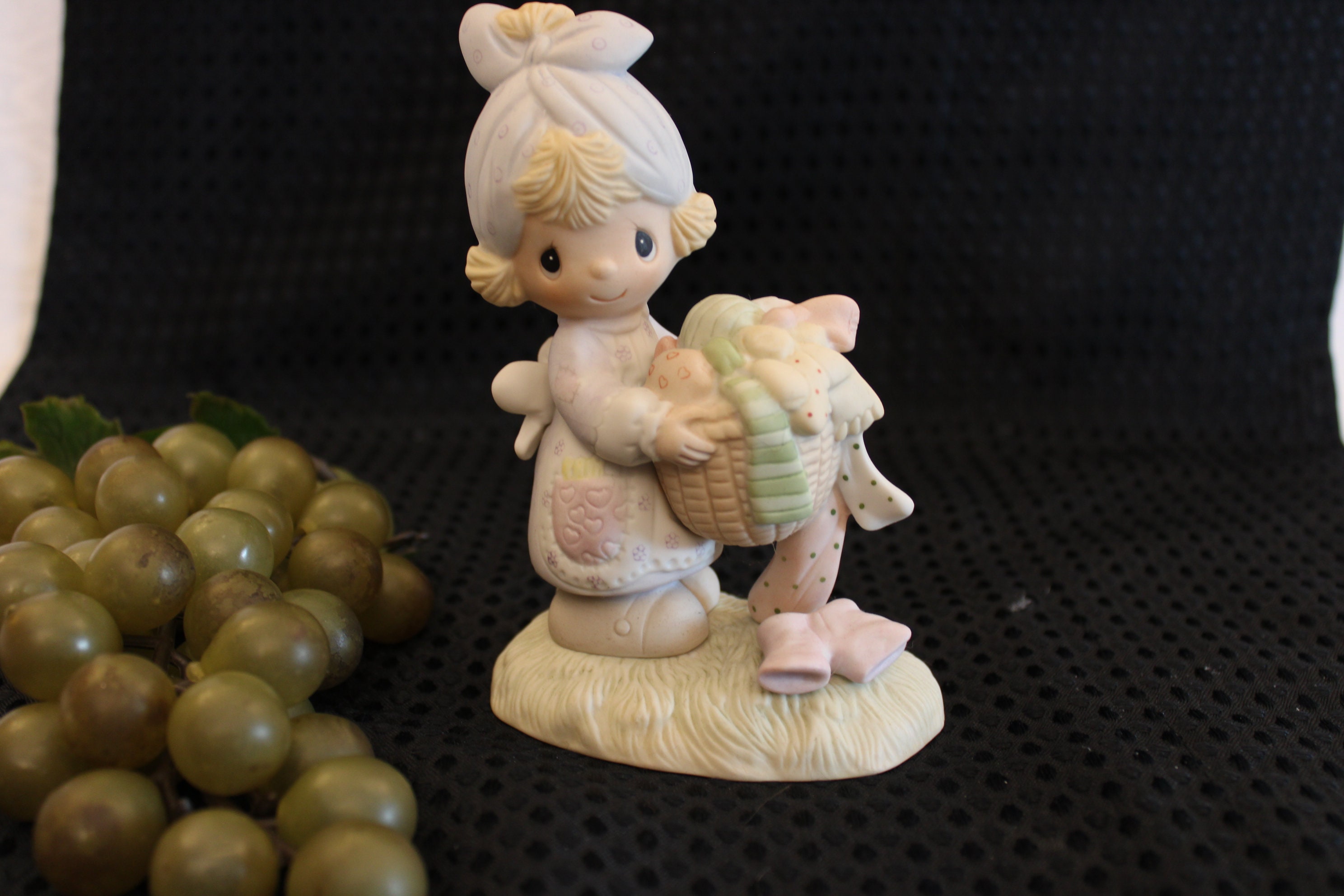1979 Precious Moments Figurine of Young Lady With Laundry Basket