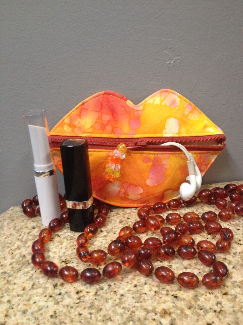 Lip coin purse-ear bud holder lipstick case