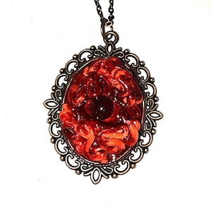parasitic eyeball pendant, body horror pendant, horror eye pendant, handmade sculpted art pendant