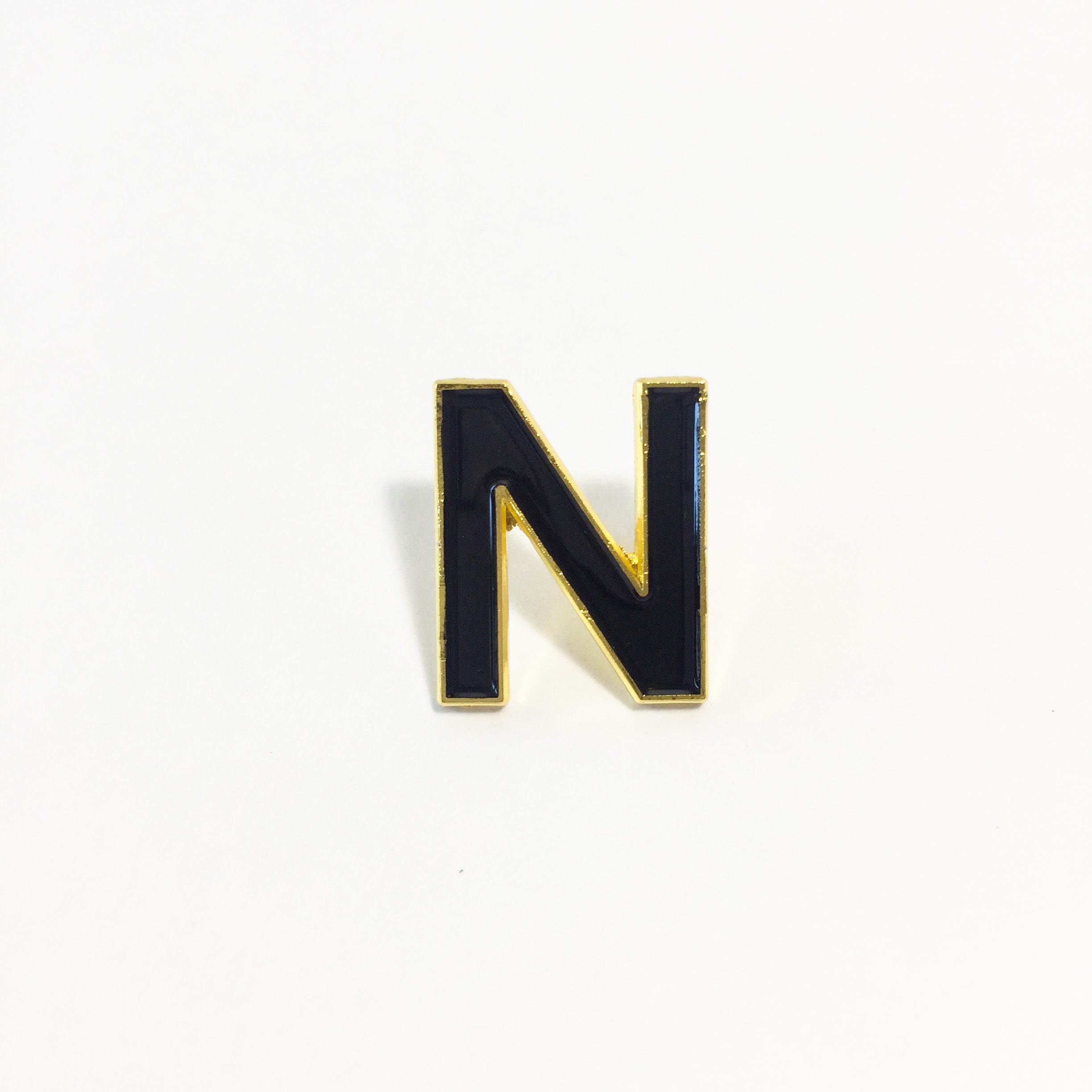 No Red Circle And Slash Symbol Over The Letter N Cloisonné Tie Lapel Pin  .75