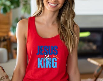May include: Red tank top with a blue and white graphic that says "JESUS is KING" with a crown above the word "KING".
