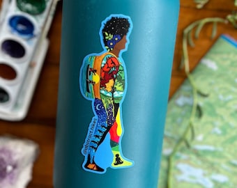 May include: Teal reusable water bottle with a sticker of a person hiking with a backpack. The sticker is colorful and features a night sky with stars and a forest scene. The text on the sticker reads "@abstract.hikes".
