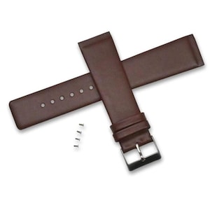 May include: Brown leather watch strap with a silver-colored buckle and four small silver-colored pins. The strap has several holes for adjustment. The watch band is a classic design.