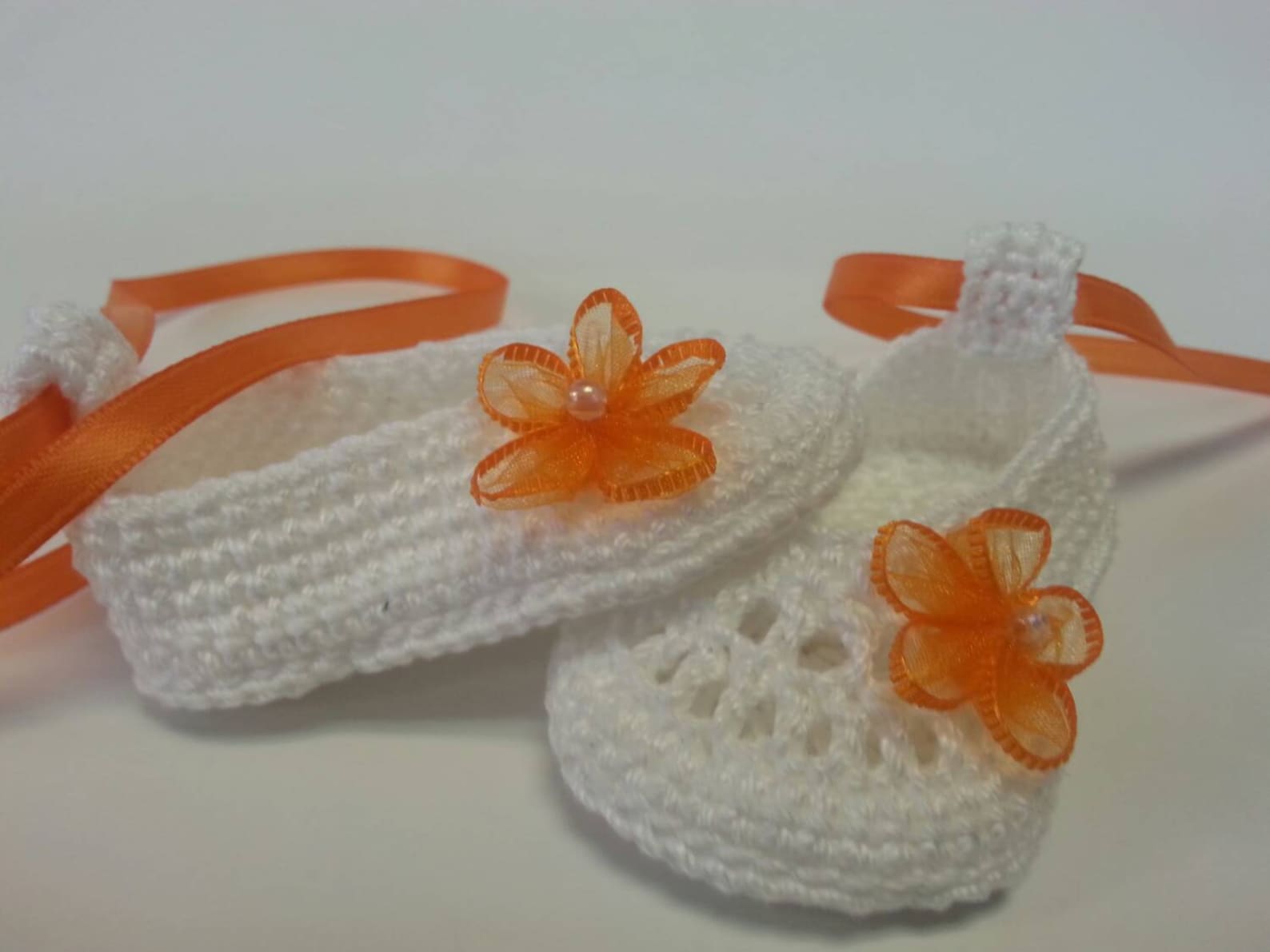 cute infant ballet slippers with orange flowers and ribbon