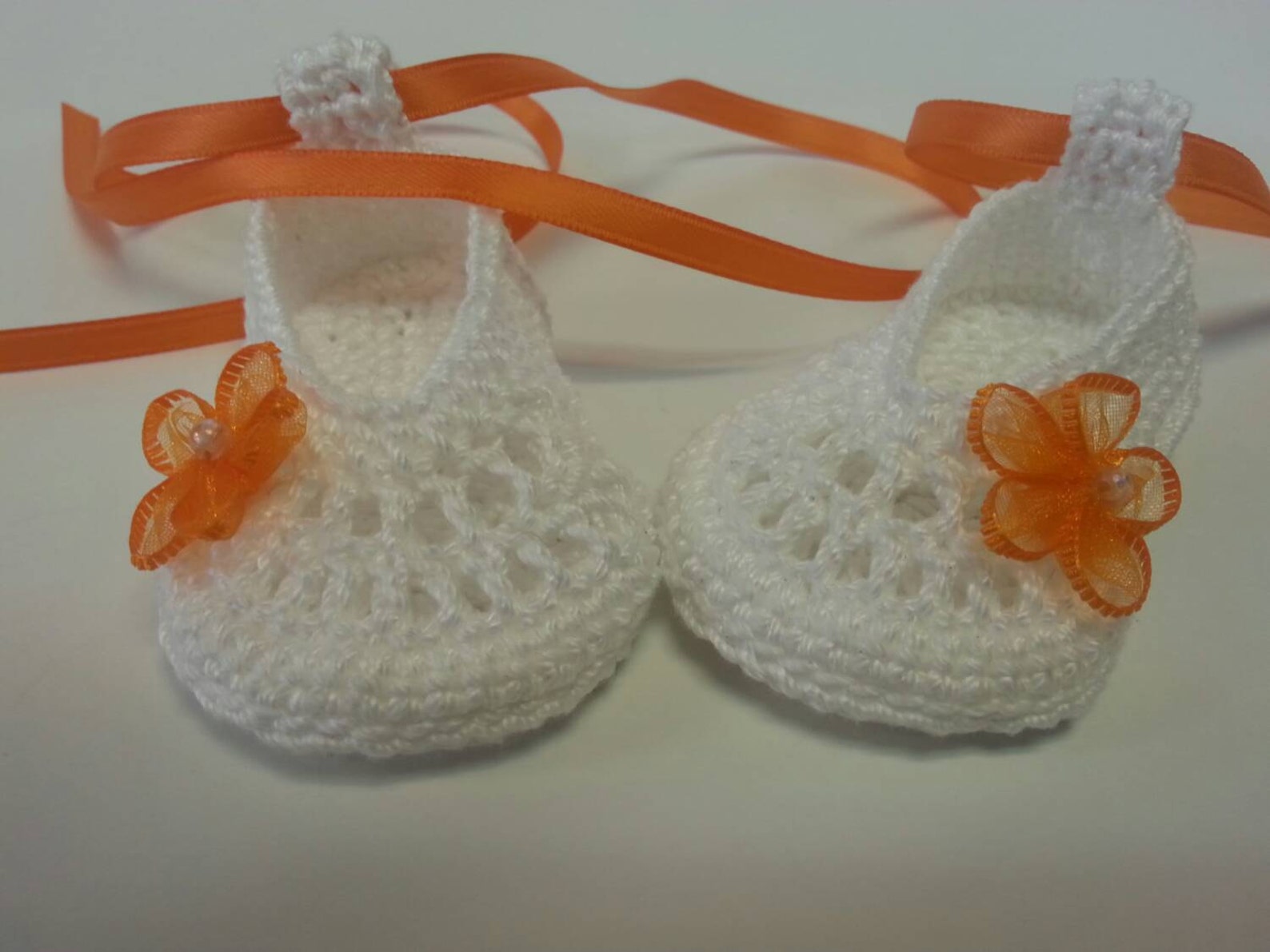 cute infant ballet slippers with orange flowers and ribbon