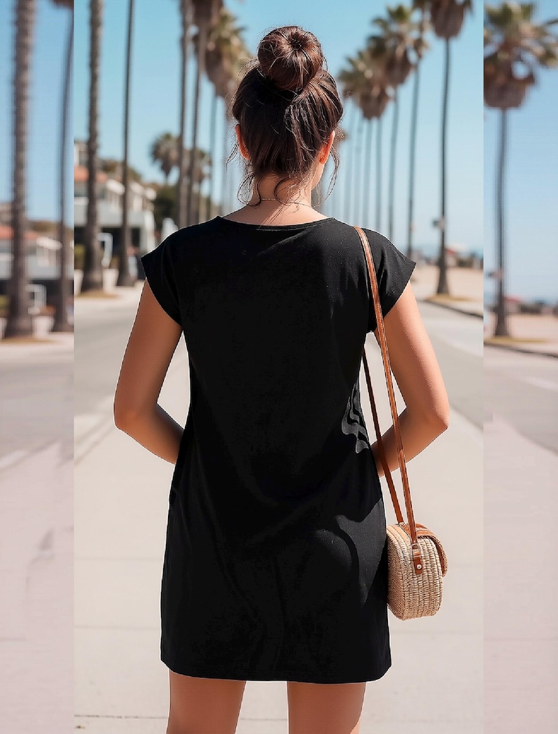 May include: A solid black short-sleeved dress with a simple round neckline and a straight hemline. The dress is worn with a small, round, woven straw crossbody bag featuring a thin brown leather strap that hangs over the shoulder.