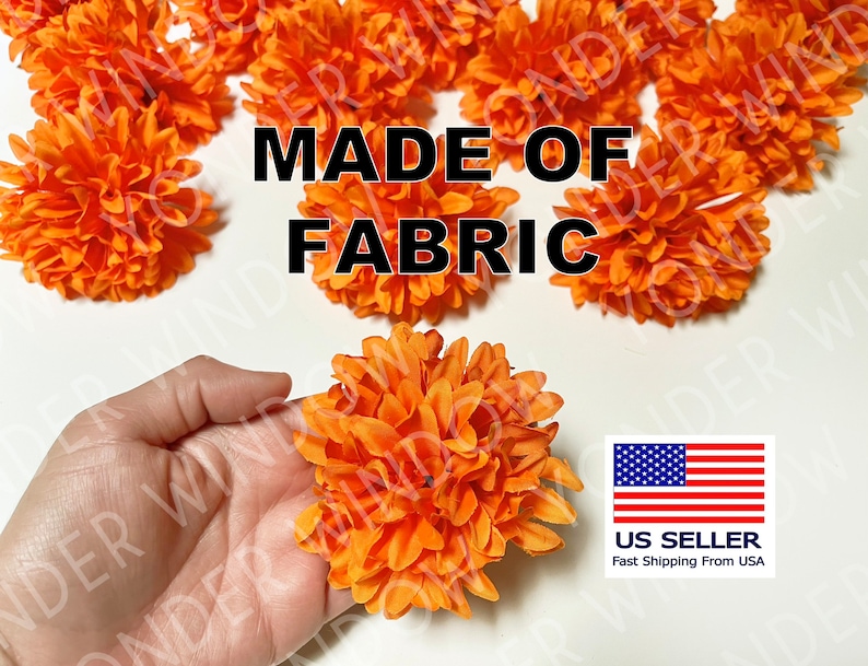 Op de afbeelding: Fel oranje stoffen bloemen, met de tekst "MADE OF FABRIC". Een hand houdt een van de bloemen vast. De afbeelding bevat een Amerikaanse vlag en de woorden "US Seller".