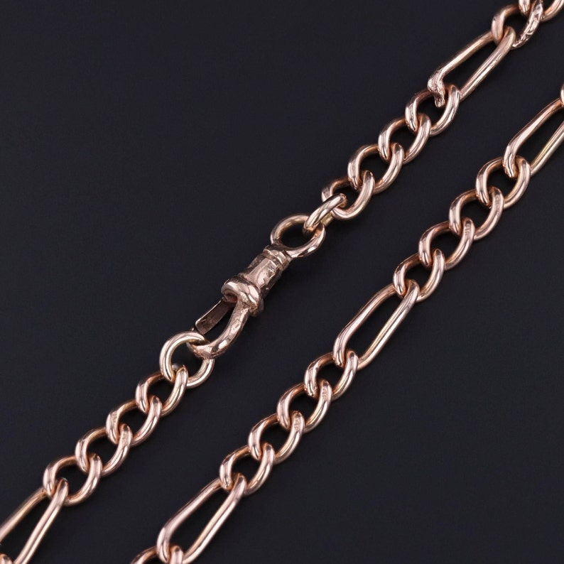 A photo of the swivel clasp and figaro links on our antique watch chain.  The links are solid gold and the chain is a great everyday jewel.  A perfect gold necklace for any occasion.