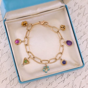 14k Gold Charm Bracelet with 7 Antique Charms image 1