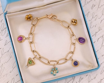 14k Gold Charm Bracelet with 7 Antique Charms