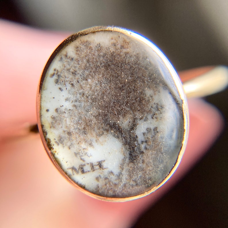A close up of our antique Georgian era mourning ring showing that it is made of macerated human hair.  The ring is in very good condition and would be perfect for a jewelry or jewellery collector.