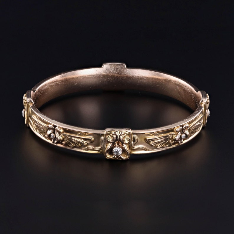 A side profile of our 14k gold Art Nouveau era Egyptian Revival diamond bangle in the style of Riker Brothers.